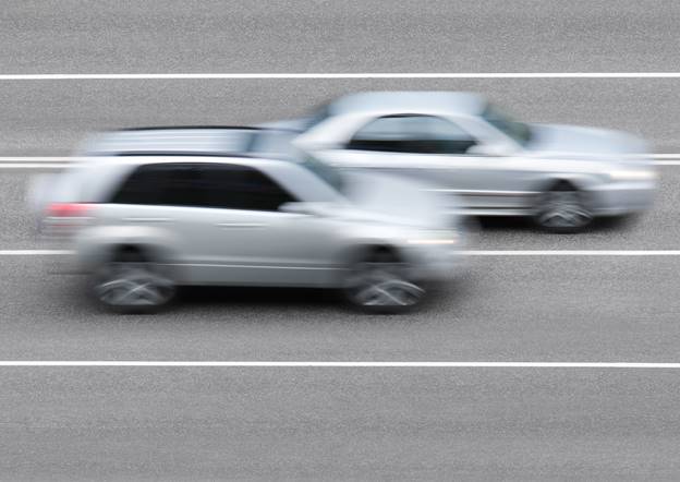 A blurry shot of cars driving on a road

AI-generated content may be incorrect.